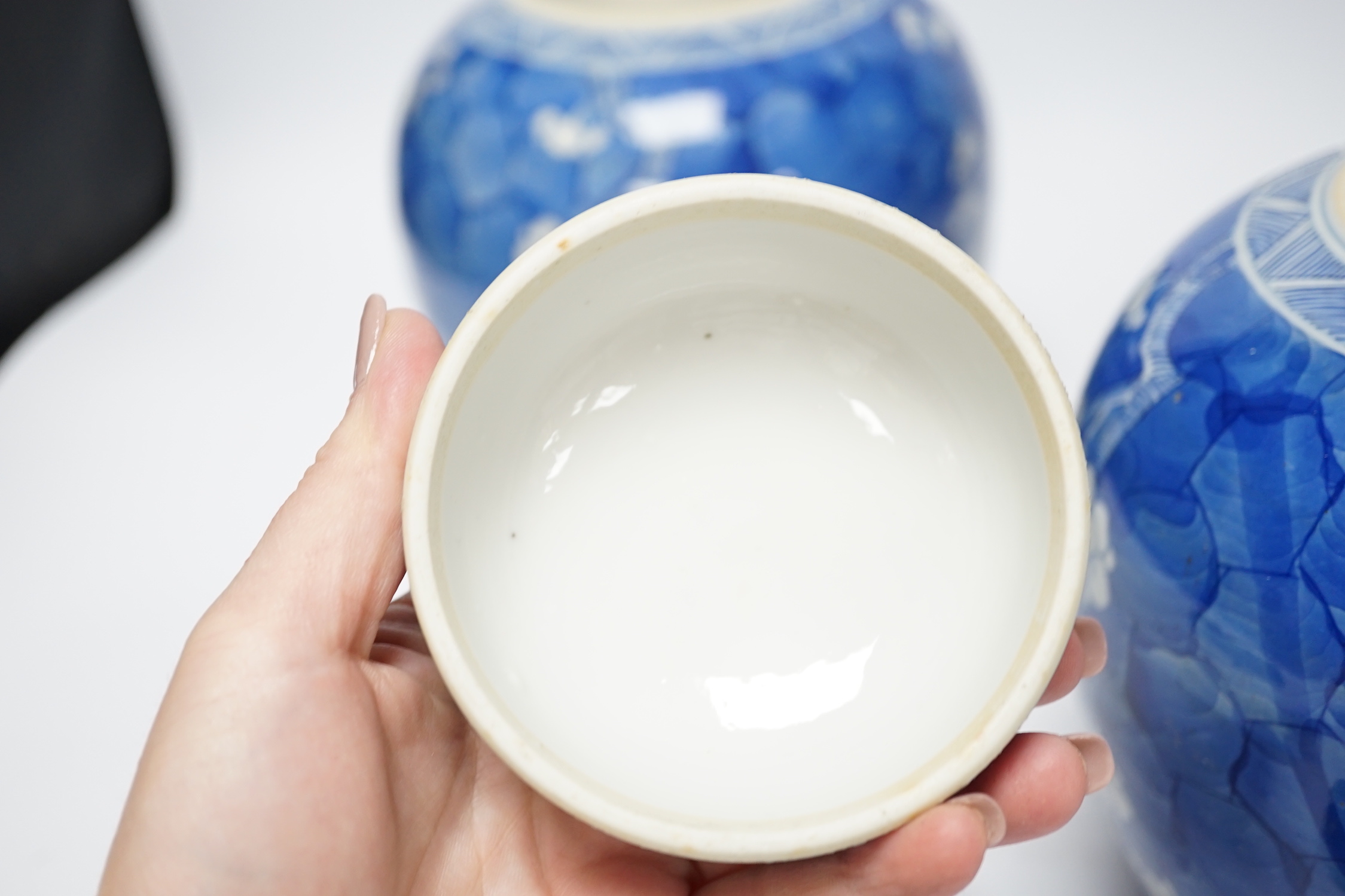 A pair of Chinese blue and white prunus jars and covers, late 19th century, 21.5cm